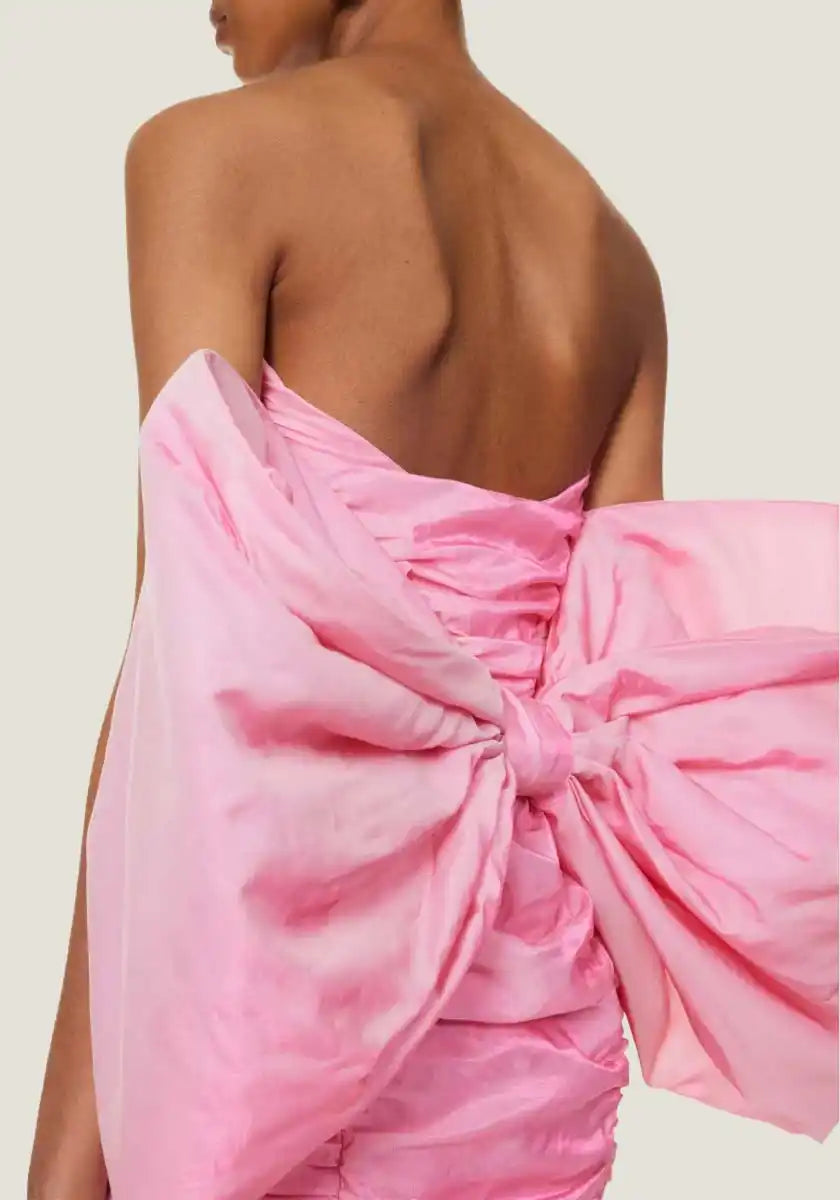 Pink strapless dress with oversized bow.