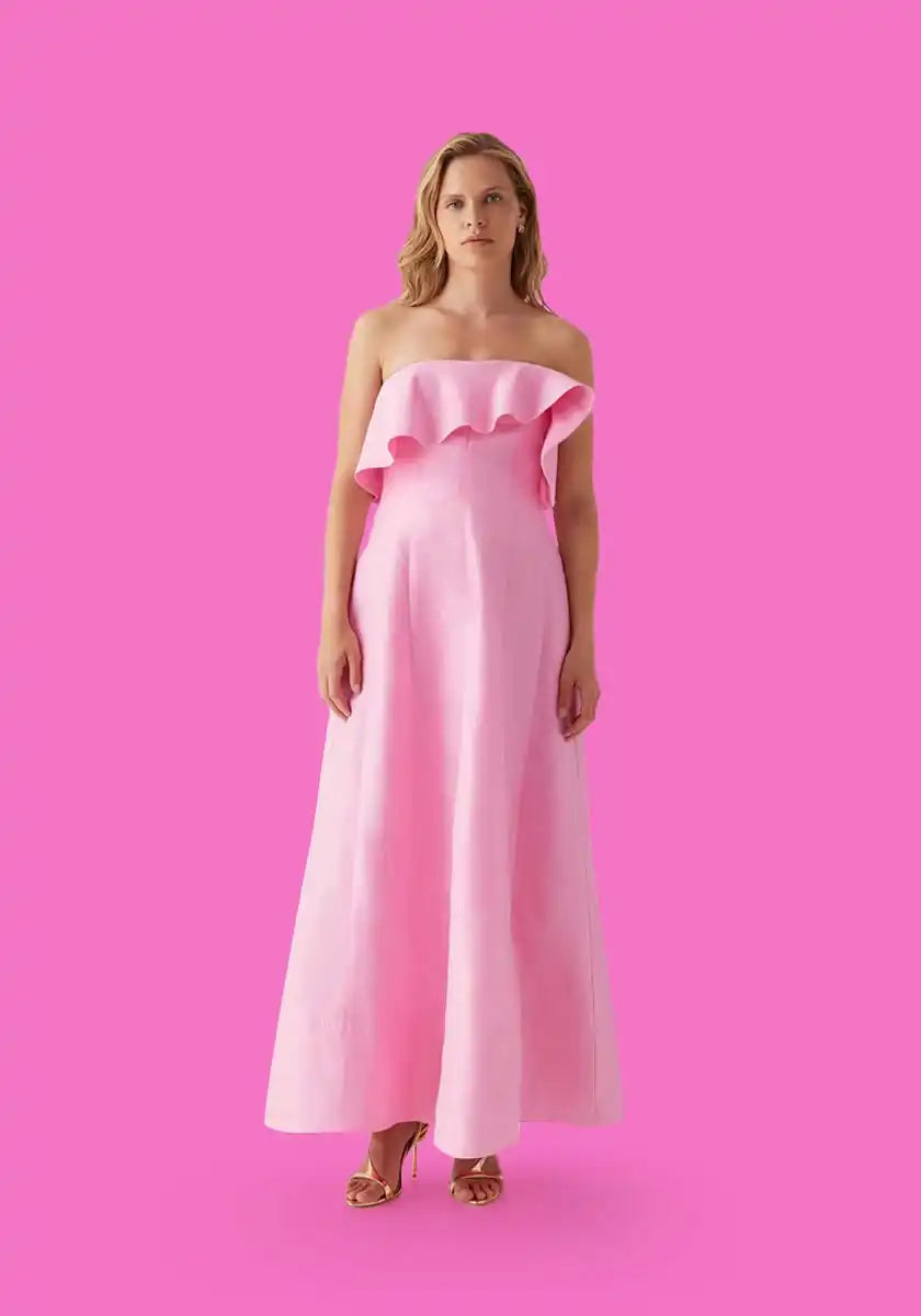 Pink strapless ruffle dress.
